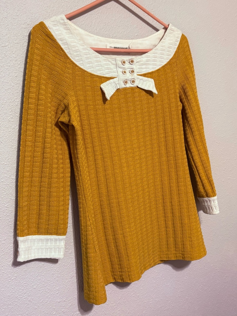 Pilcro Anthropologie Long Sleeved Knit Top With White Trim and Buttoned Cuff.